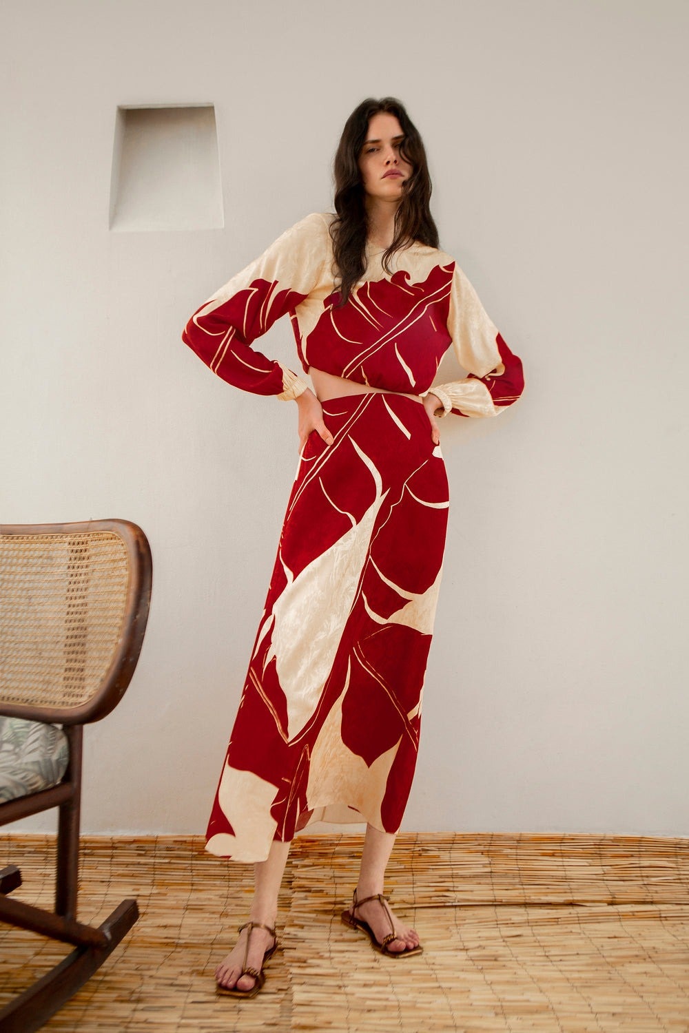 Image may contain Nina Persson Clothing Dress Fashion Formal Wear Gown Adult Person Robe Chair and Furniture